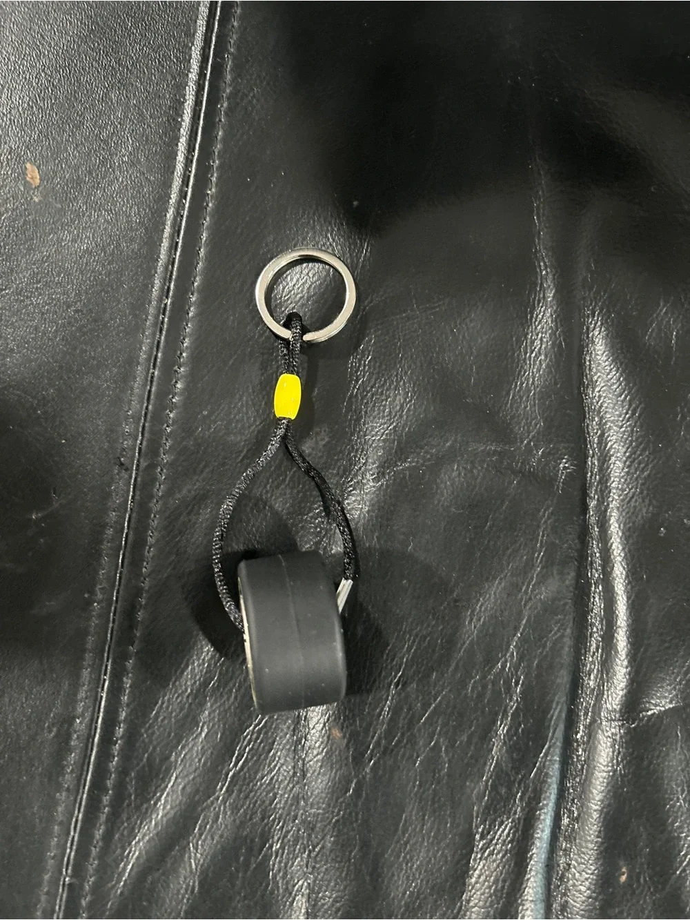 Invicta Black tire Keychain with Yellow Accent